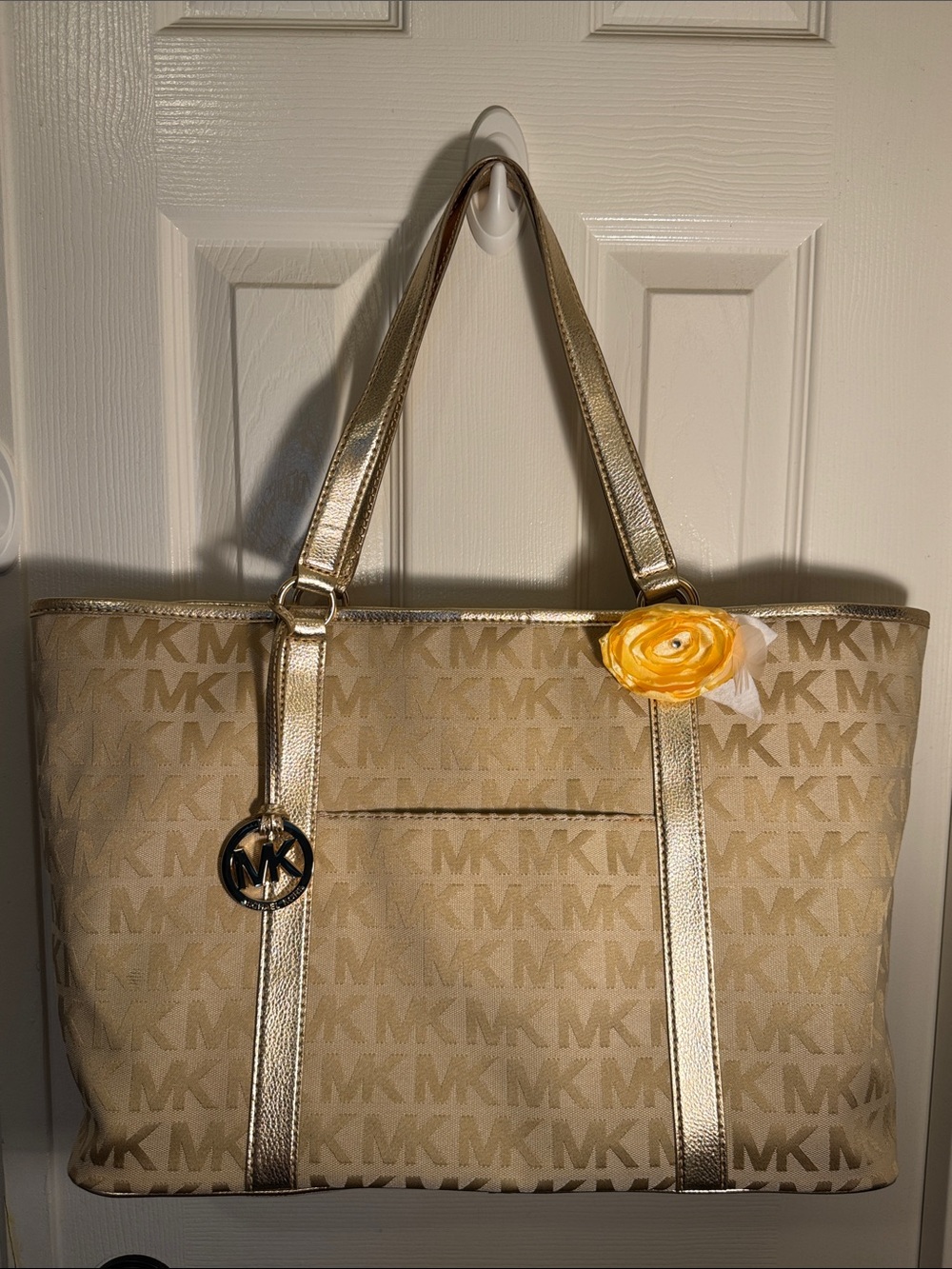 A Michael Kors Beige and Gold MK Logo Canvas Tote